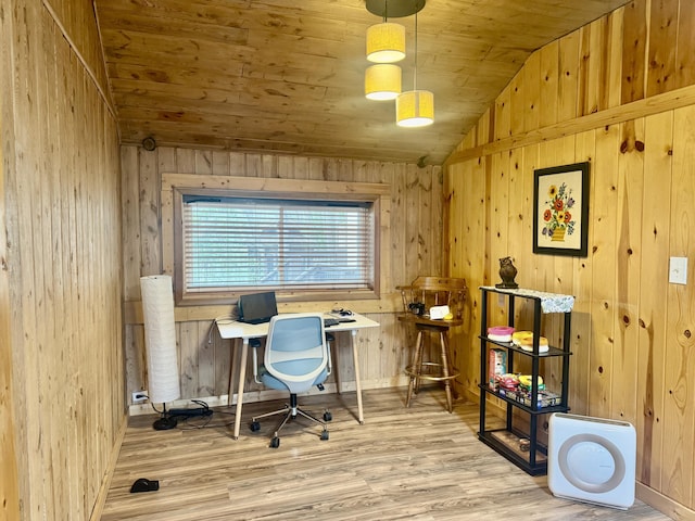 office with wooden walls, wood finished floors, vaulted ceiling, and wooden ceiling