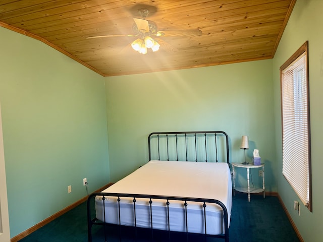 bedroom with wooden ceiling, carpet floors, baseboards, and a ceiling fan
