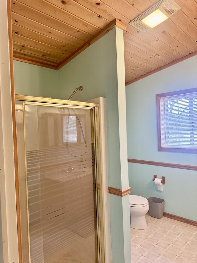 bathroom with crown molding, wood ceiling, a stall shower, and toilet