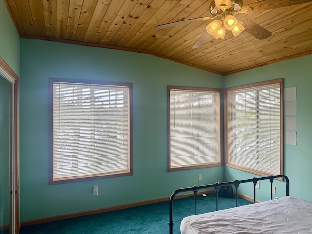 bedroom with crown molding, baseboards, multiple windows, and carpet