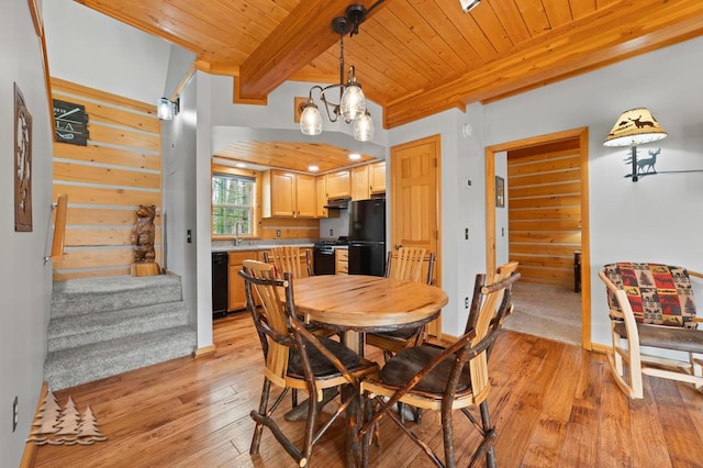 dining area with beamed ceiling, wood ceiling, stairway, and light wood-type flooring