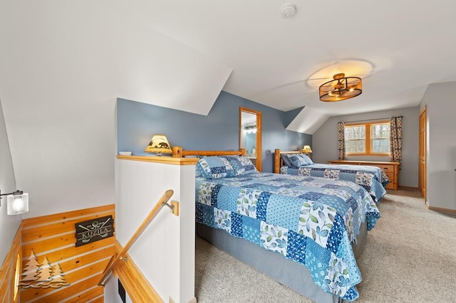 carpeted bedroom featuring baseboards