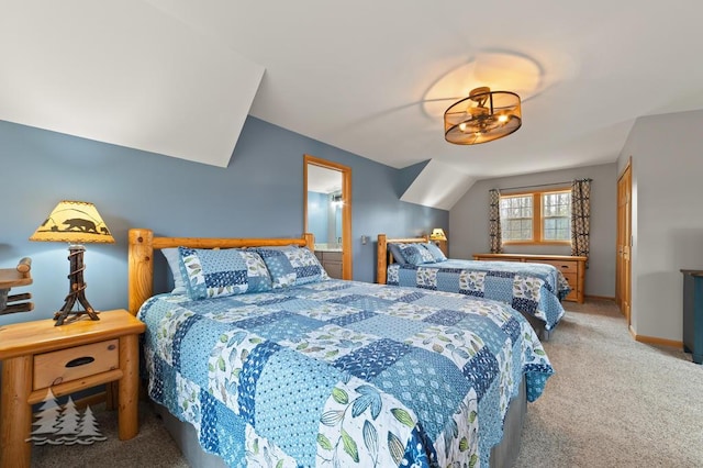 bedroom with carpet floors and baseboards