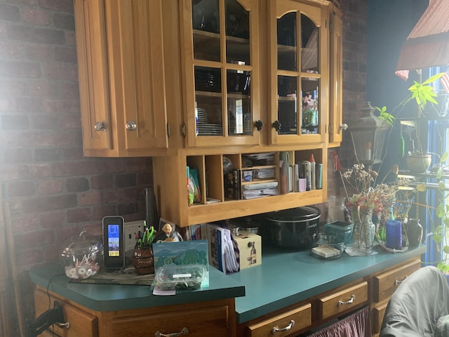 interior space featuring brick wall
