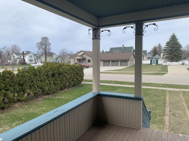 unfurnished sunroom featuring a residential view