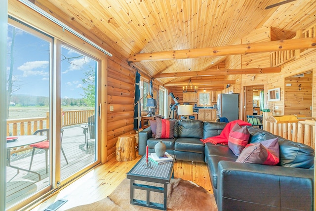 living room featuring visible vents, light wood-type flooring, rustic walls, lofted ceiling with beams, and an inviting chandelier