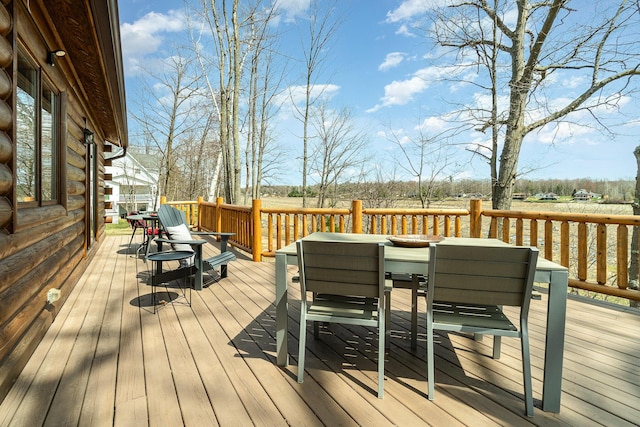deck with outdoor dining space