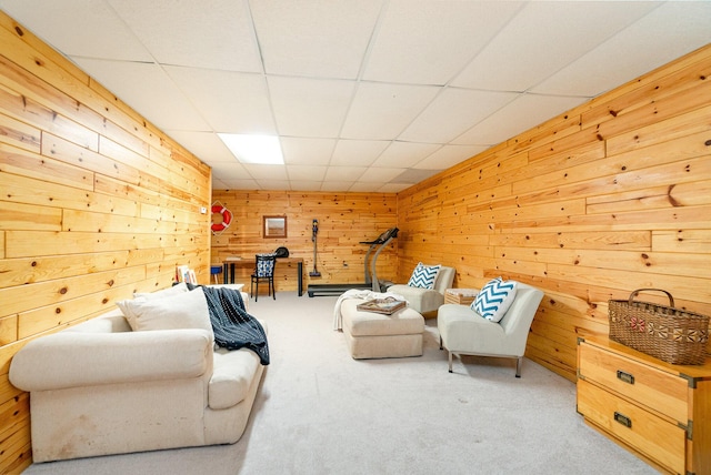 3525 E Pointe Dr, Beaverton, MI 48612 - living room with carpet flooring, wood walls, and a paneled ceiling