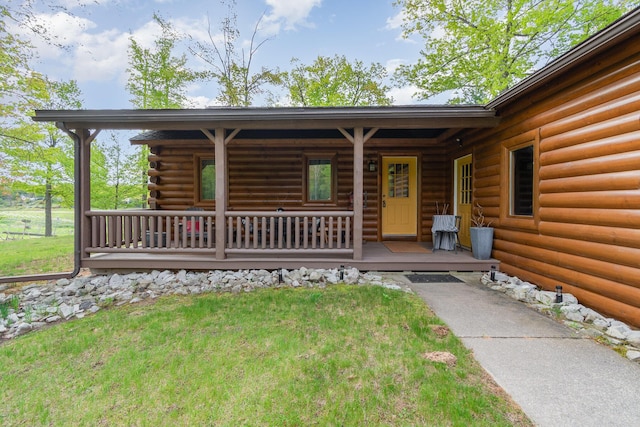 3525 E Pointe Dr, Beaverton, MI 48612 - property entrance featuring a porch and a yard