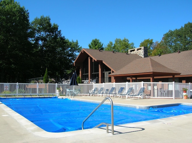 1406 Opal Lake Rd, Gaylord, MI 49735 - community pool featuring a patio