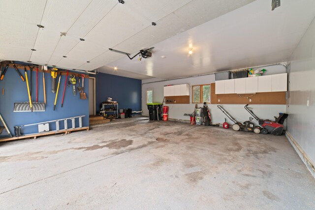 1406 Opal Lake Rd, Gaylord, MI 49735 - garage with a garage door opener