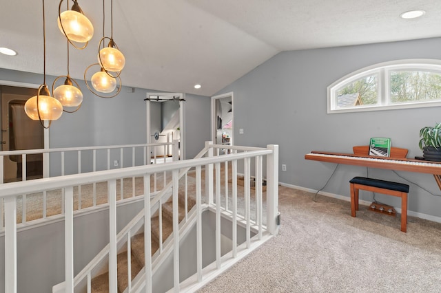 1406 Opal Lake Rd, Gaylord, MI 49735 - hall with lofted ceiling, carpet flooring, an upstairs landing, baseboards, and recessed lighting