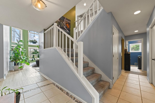 1406 Opal Lake Rd, Gaylord, MI 49735 - staircase featuring tile patterned flooring, baseboards, and recessed lighting