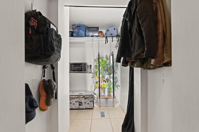 1406 Opal Lake Rd, Gaylord, MI 49735 - spacious closet featuring tile patterned flooring