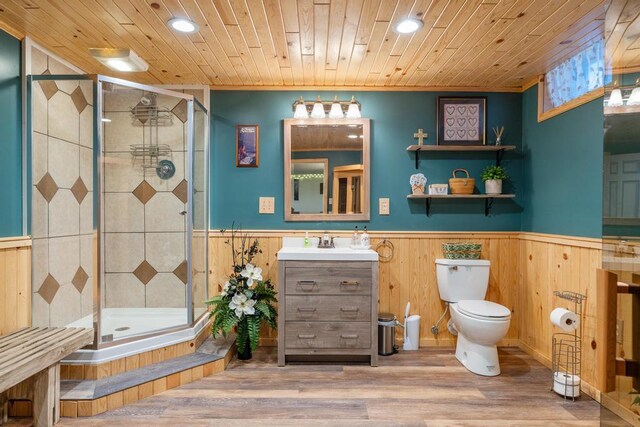 6075 W Edgar St, Pellston, MI 49769 - full bathroom with a wainscoted wall, a shower stall, recessed lighting, toilet, and vanity