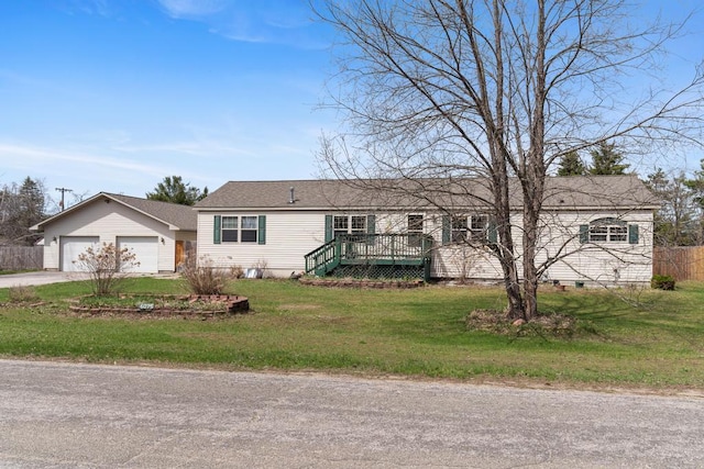 6075 W Edgar St, Pellston, MI 49769 - ranch-style house featuring a front yard, an attached garage, concrete driveway, and a wooden deck
