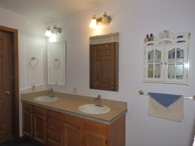 full bath with a sink and double vanity