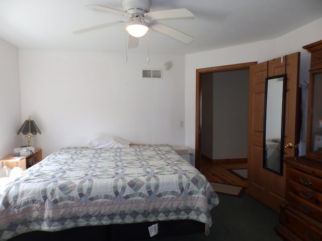 bedroom featuring ceiling fan and visible vents