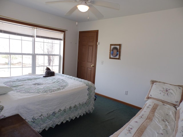 bedroom with baseboards and ceiling fan