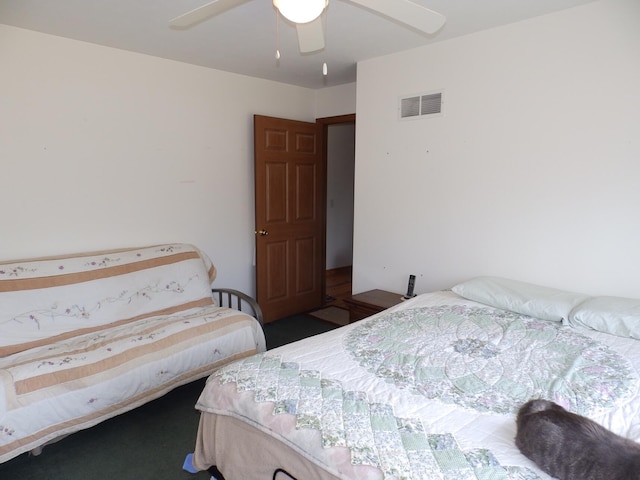 bedroom with ceiling fan and visible vents