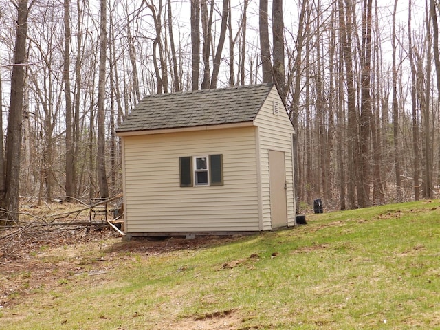view of shed featuring a forest view