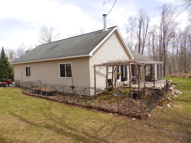 view of side of home with a yard, a patio area, a pergola, and a shingled roof