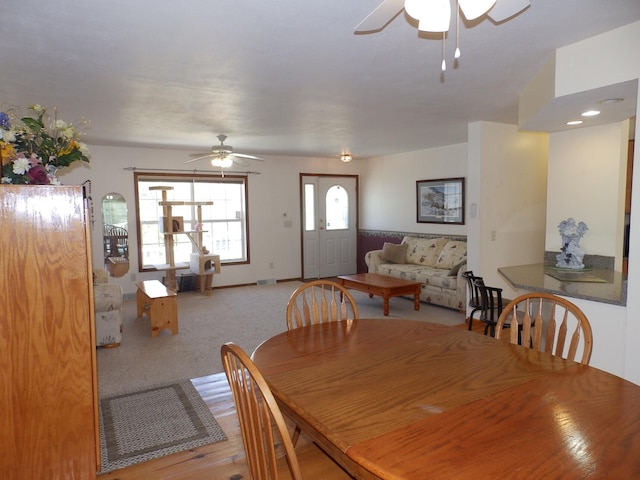dining area featuring ceiling fan and visible vents