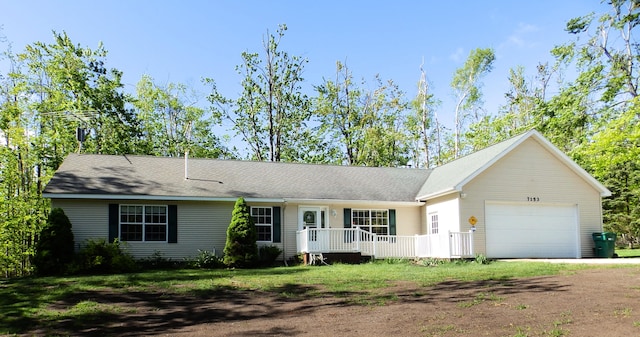 7153 Sugar Hill Cir, Gaylord, MI 49735 - ranch-style home with dirt driveway and a garage