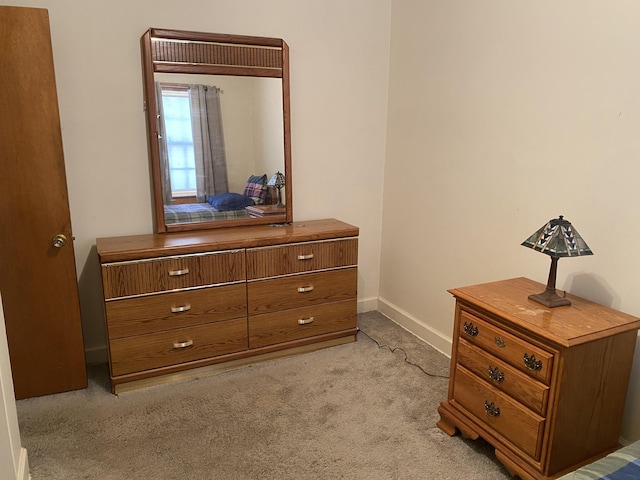 carpeted bedroom with baseboards
