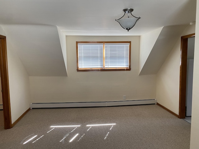 bonus room featuring baseboards, baseboard heating, and carpet