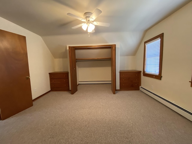 additional living space featuring ceiling fan, baseboard heating, and vaulted ceiling