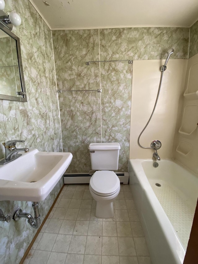 full bathroom featuring a sink, tile patterned flooring, toilet, shower / bathing tub combination, and a baseboard heating unit