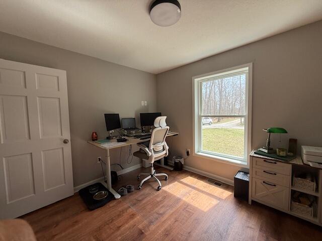 office area featuring baseboards and wood finished floors