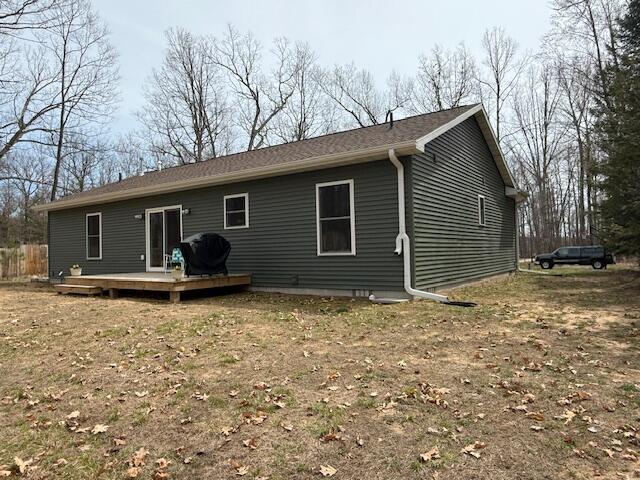 back of property featuring a deck