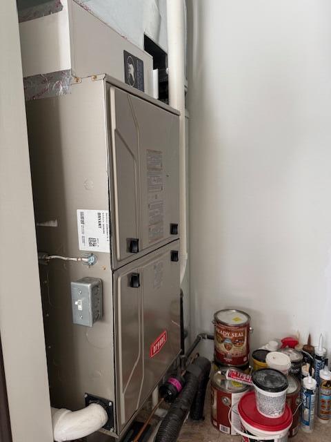 utility room with heating unit