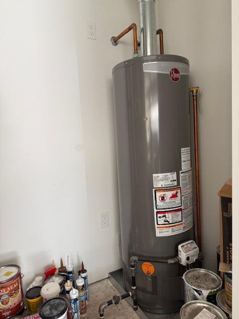 utility room featuring water heater