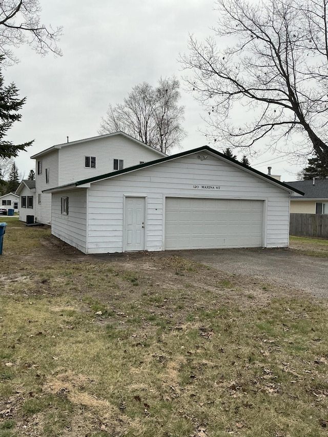 120 Marina St, Houghton Lake, MI 48629 - garage with fence