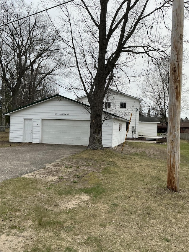 120 Marina St, Houghton Lake, MI 48629 - exterior space with a garage