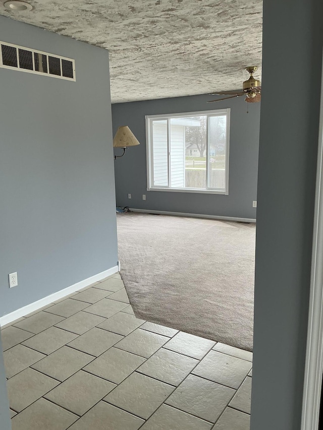120 Marina St, Houghton Lake, MI 48629 - empty room featuring light colored carpet, baseboards, ceiling fan, and visible vents