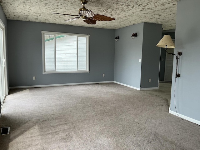 120 Marina St, Houghton Lake, MI 48629 - spare room featuring carpet flooring, ceiling fan, visible vents, and baseboards