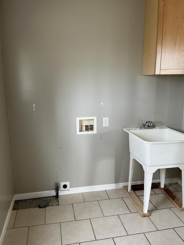 120 Marina St, Houghton Lake, MI 48629 - laundry room featuring hookup for an electric dryer, cabinet space, baseboards, hookup for a washing machine, and light tile patterned flooring