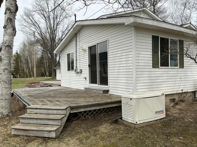 120 Marina St, Houghton Lake, MI 48629 - back of house with a wooden deck