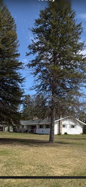 view of front of home with a front yard