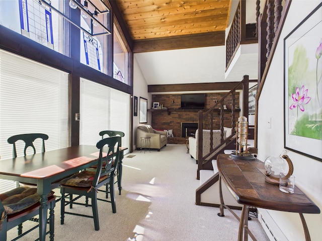 carpeted dining area with beam ceiling, a brick fireplace, high vaulted ceiling, stairs, and wood ceiling