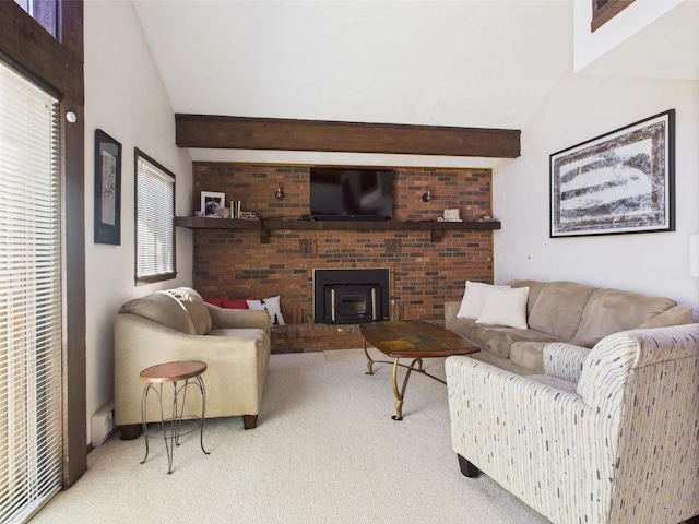 carpeted living room with lofted ceiling with beams and a fireplace