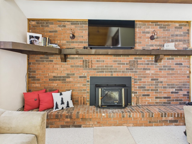 living area with carpet floors and a wood stove