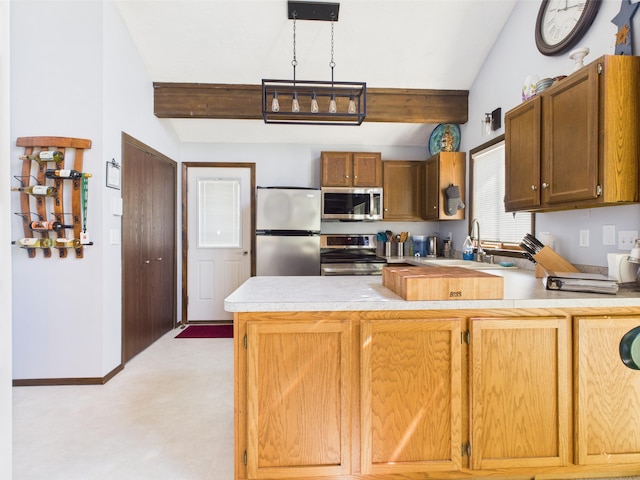 kitchen featuring lofted ceiling with beams, a sink, light countertops, stainless steel appliances, and a peninsula