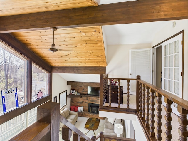 interior space with vaulted ceiling with beams and wood ceiling