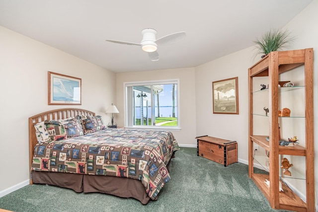 carpeted bedroom with baseboards and a ceiling fan