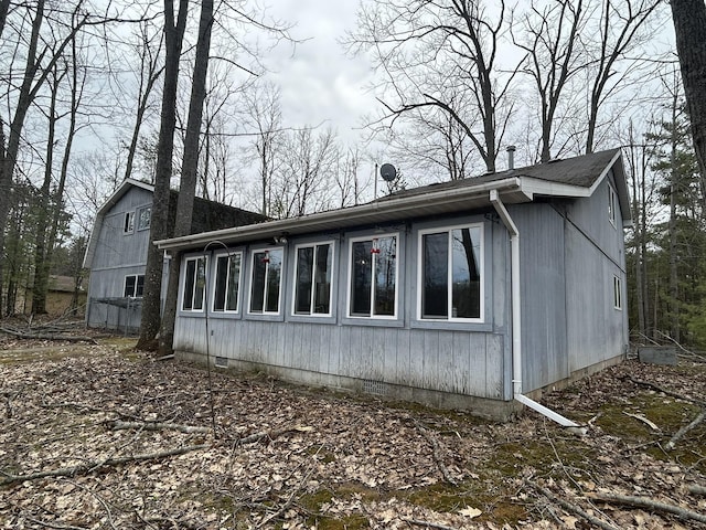 view of side of home with crawl space